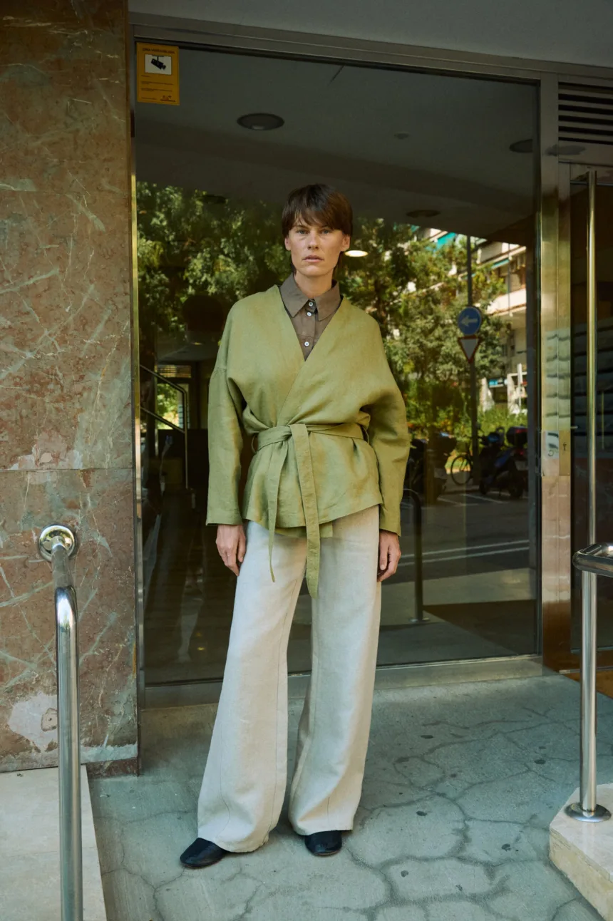 Natural grey heavy linen wide-leg trousers styled with an olive green wrap jacket and brown linen shirt