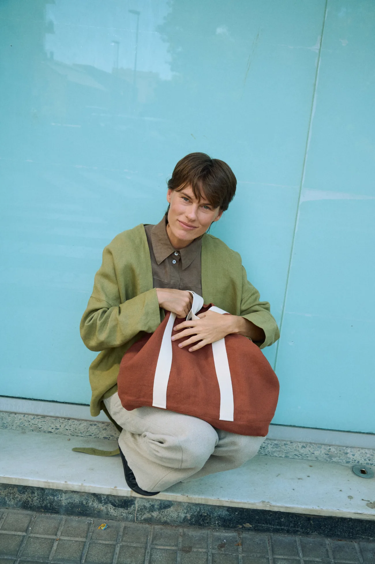 Terracotta heavy linen tote bag with wide cotton handles and spacious structured design