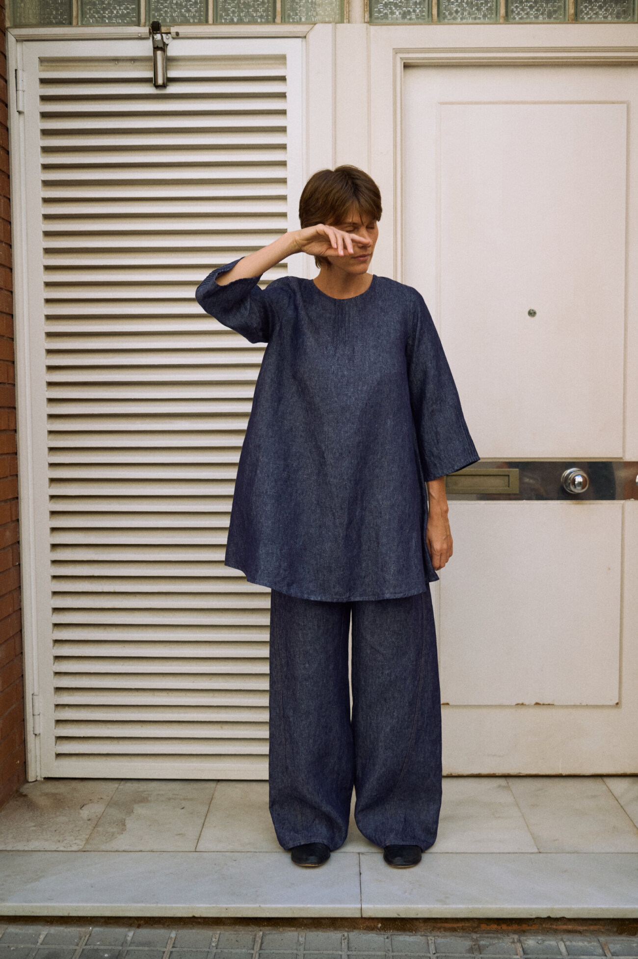 Blue denim linen pants with wide legs, paired with a relaxed matching linen dress layered over them