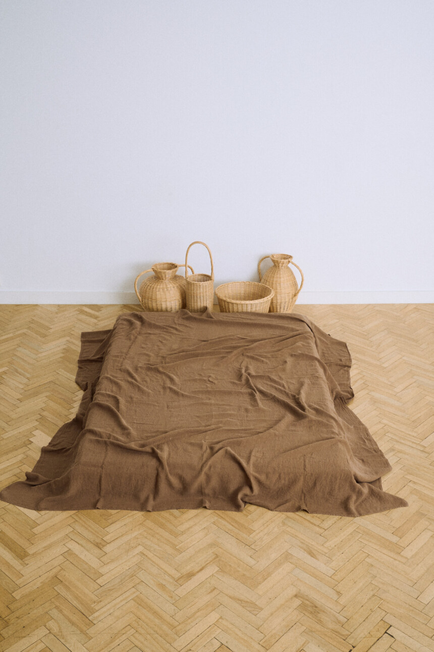 Brown flat linen sheet in cacao with a soft washed finish.