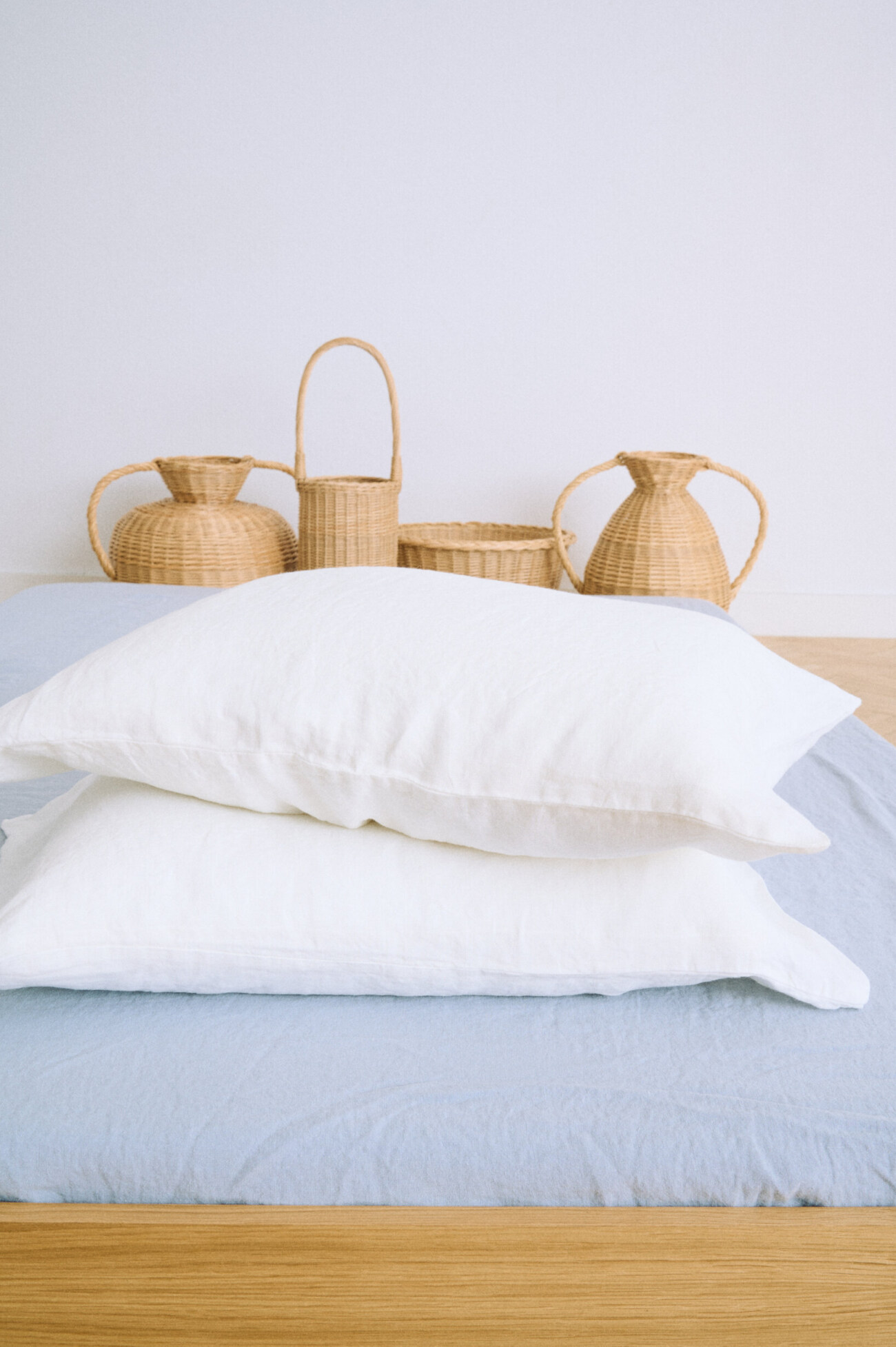 White linen pillowcase in milky white with envelope closure and relaxed washed finish.