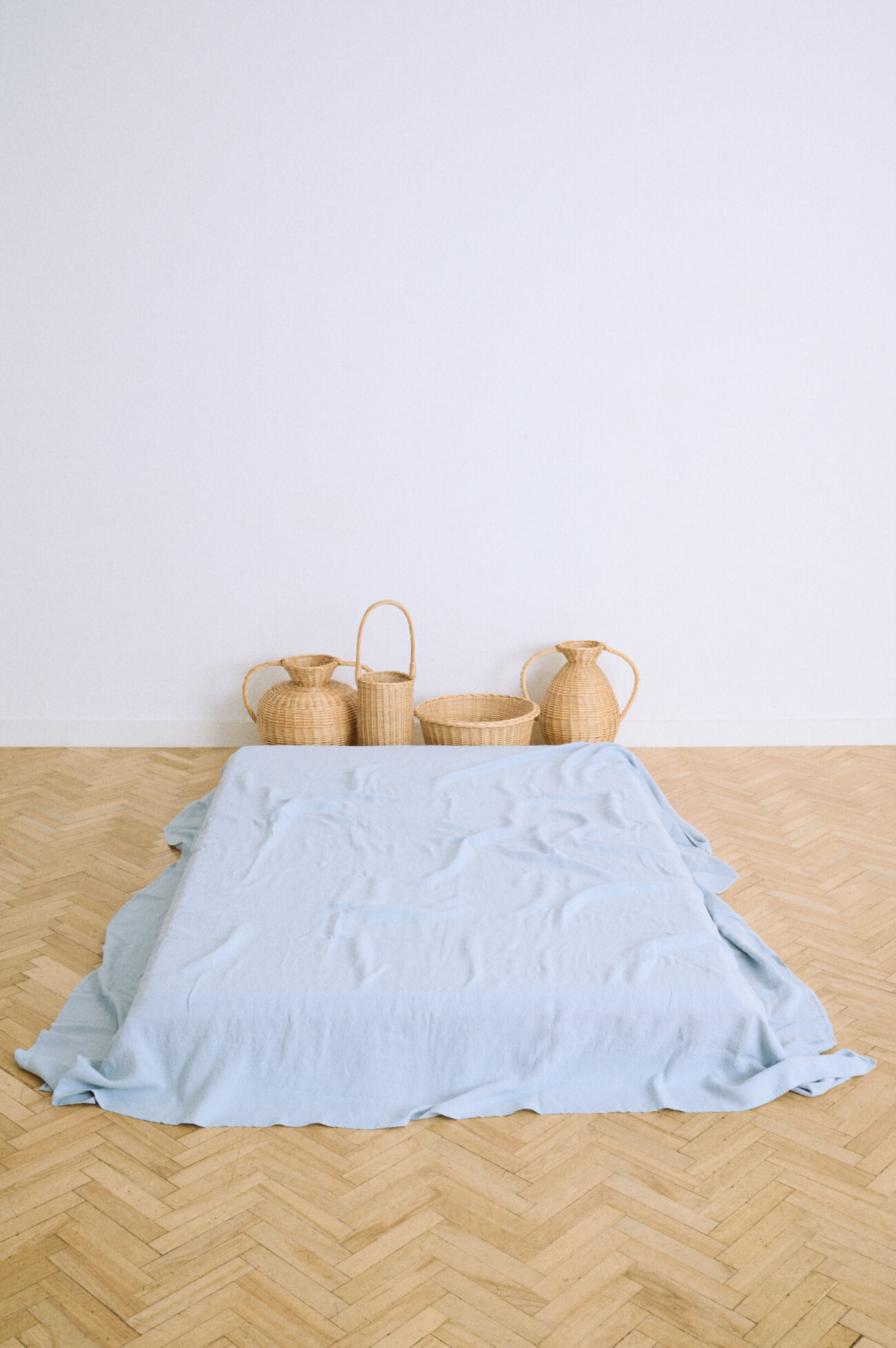 Blue linen flat sheet in dusty blue with a relaxed washed finish.