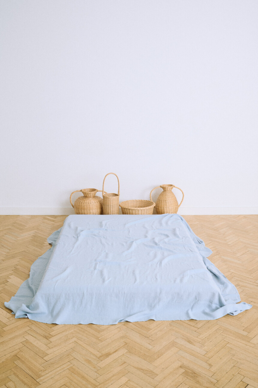 Blue linen flat sheet in dusty blue with a relaxed washed finish.