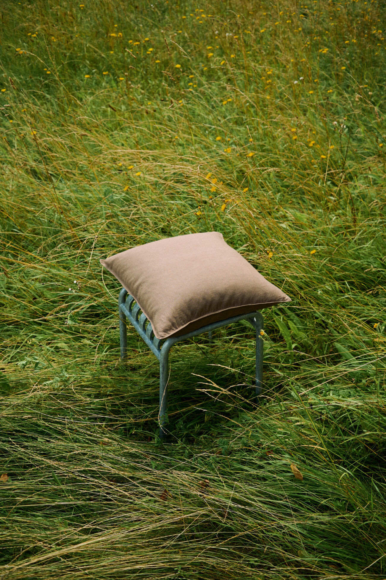 Cacao brown linen pillow cover with decorative stitched edges.