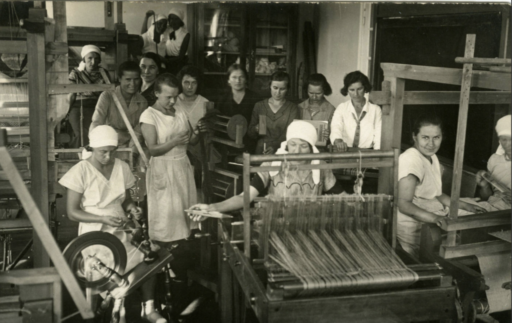 Women spinning and weaving linen in a Lithuanian linen factory